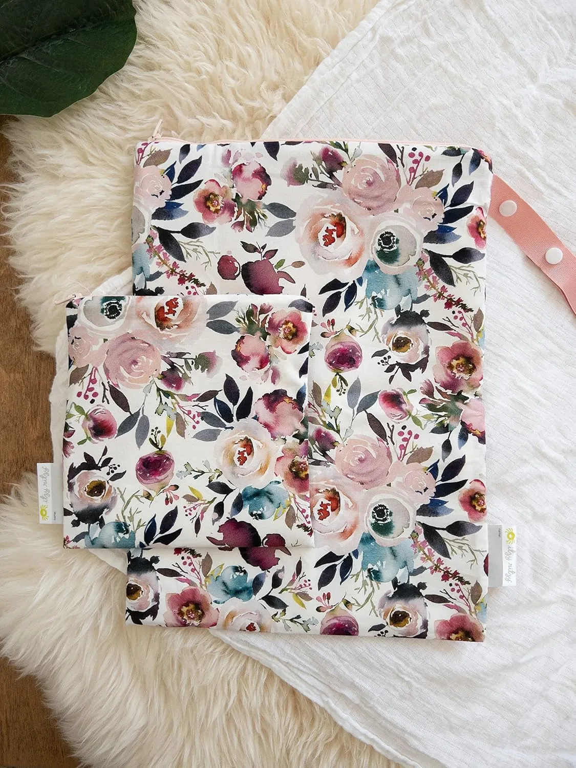 Itzy Ritzy Sealed Wet Bag with Handle – Wet Bag for Travel, Swimsuits, Cloth Diapers, Gym Clothes & Toiletries - Washable & Reusable with Water Resistant Lining - Measures 11” x 14” (Blush Floral)